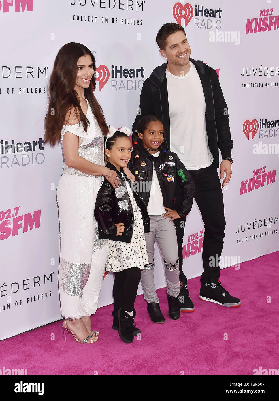 CARSON, CA - JUNE 01: Roselyn Sanchez (L) and Eric Winter attend 2019