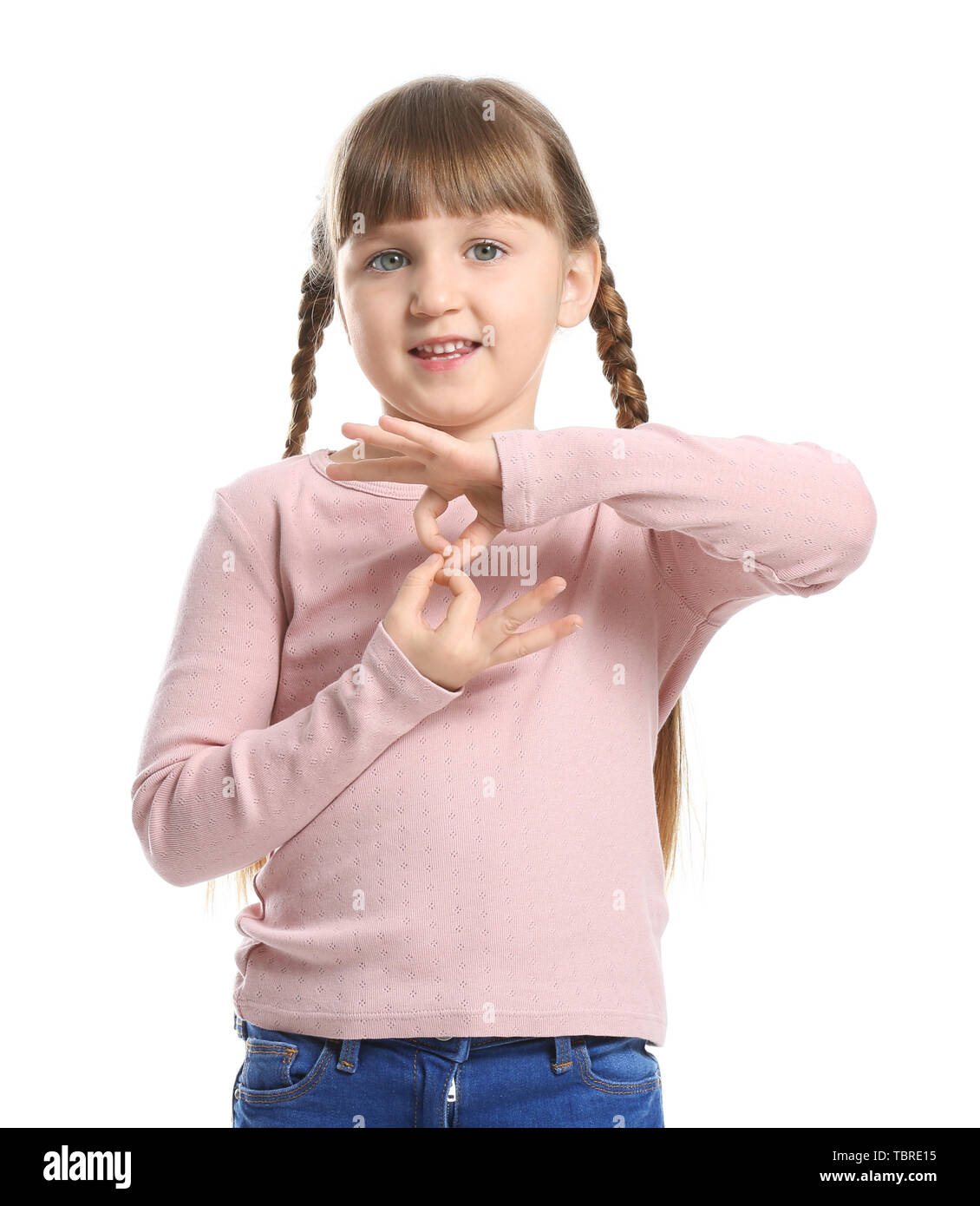 Cute deaf mute girl using sign language on white background Stock Photo