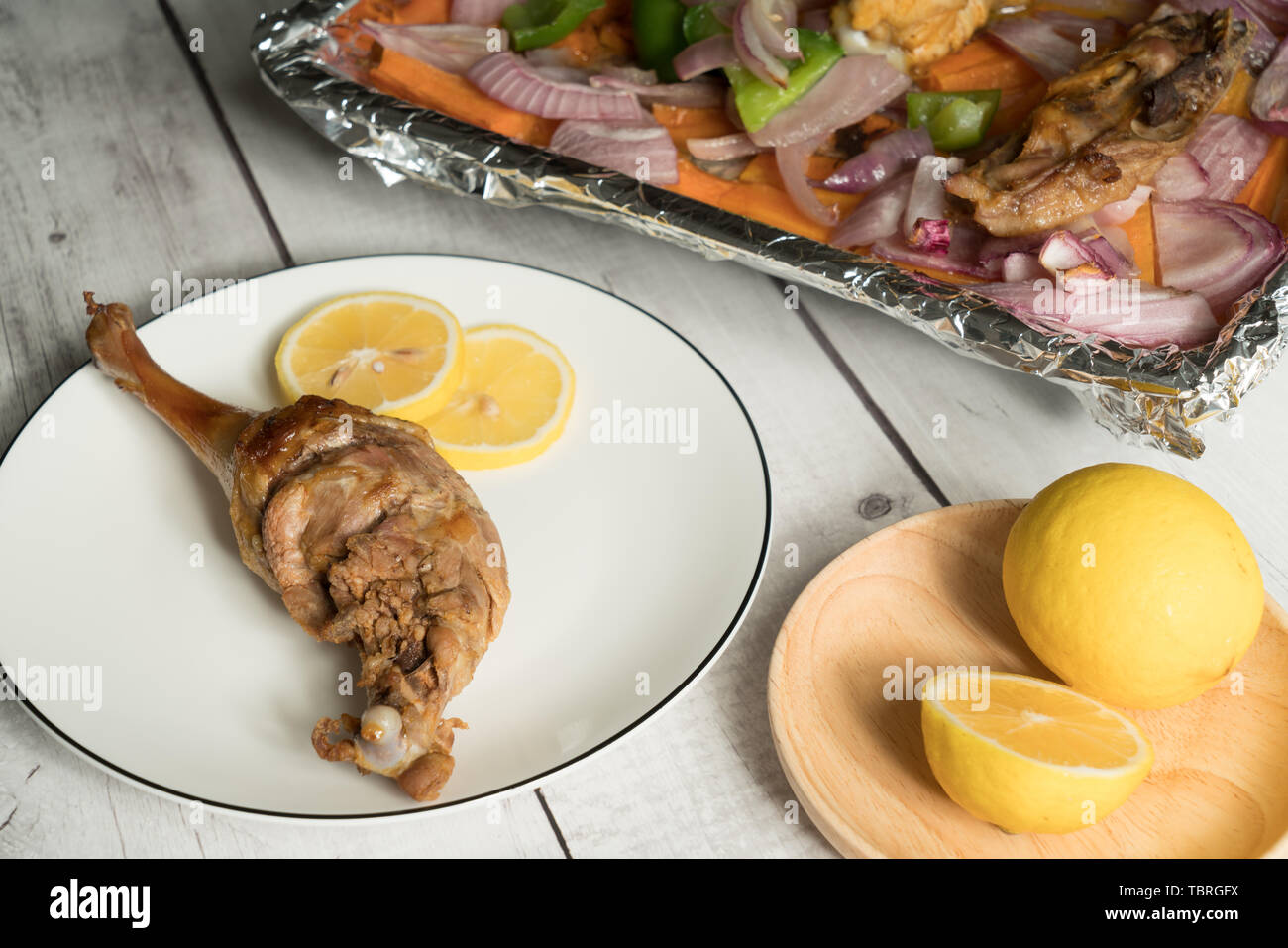 Roast duck leg with light color background Stock Photo - Alamy