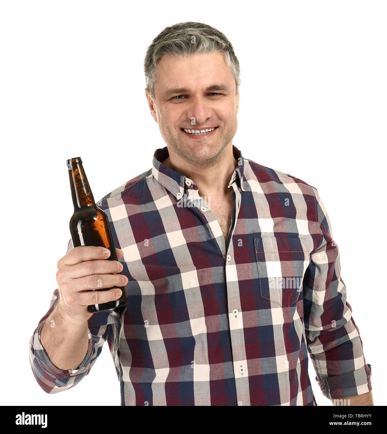 Portrait of happy mature man with bottle of beer on white background ...