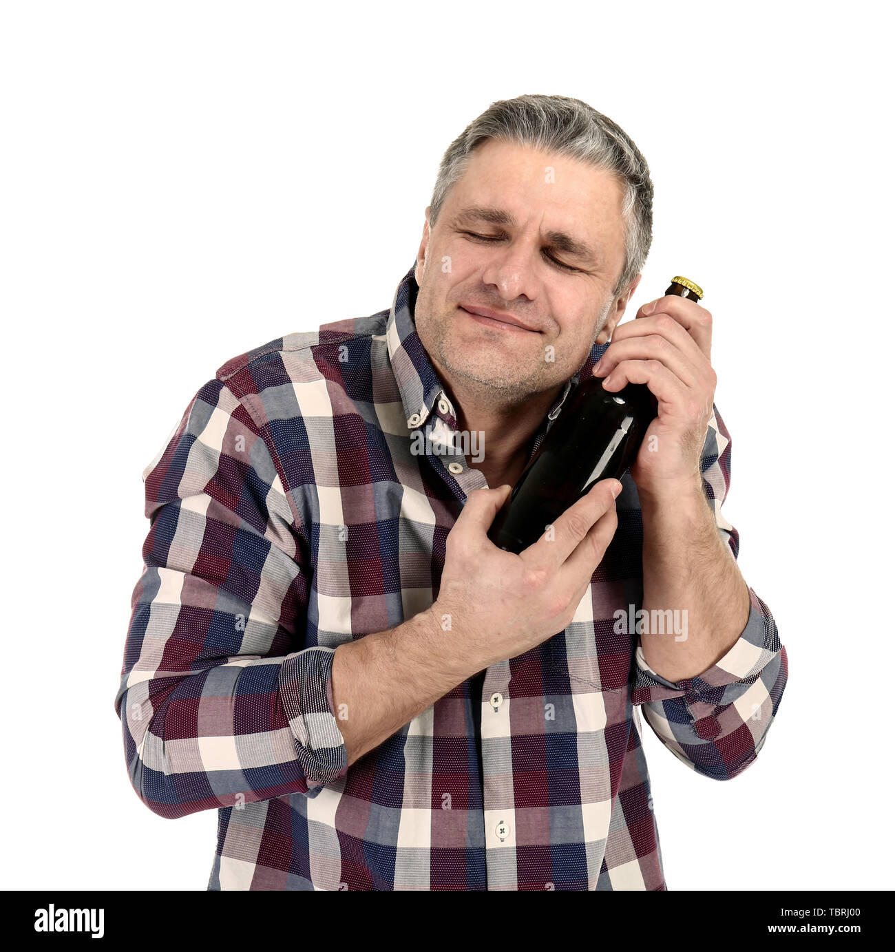 Portrait of happy mature man with bottle of beer on white background ...