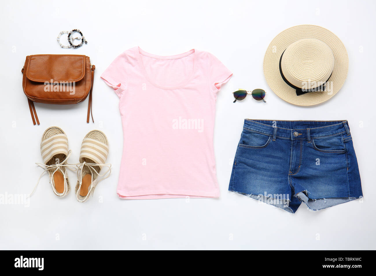 Stylish female clothes with accessories on white background Stock Photo