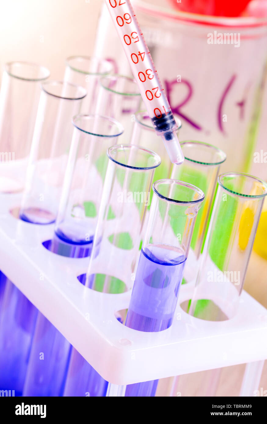 set of test tubes with blue liquid on the desktop Stock Photo - Alamy