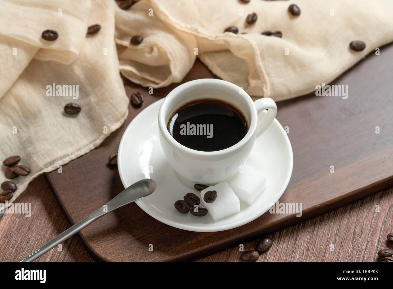 Dark brown background on table cloth and coffee Stock Photo