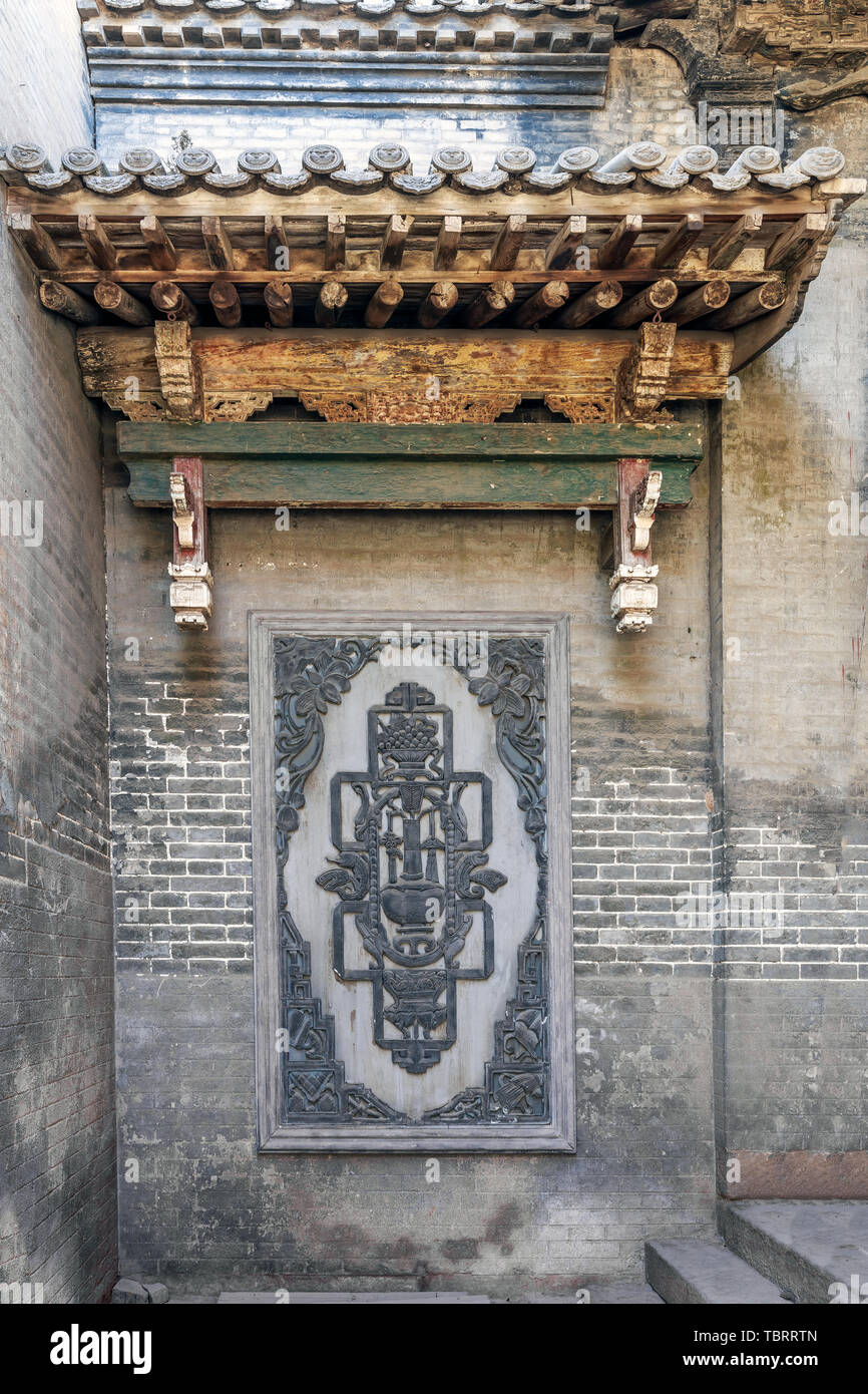 Ancient building brick carving wall in Cao Jia compound (Sanduo Hall), Taigu, Shanxi Province Stock Photo