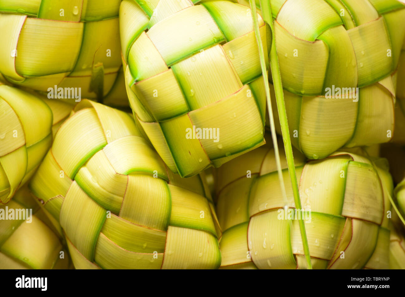 Ketupat 'asian rice dumpling'. Ketupat is a natural rice casing made from young coconut leaves for cooking rice during eid Mubarak Eid ul Fitr Stock Photo