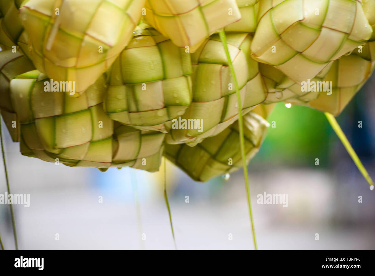 Ketupat 'asian rice dumpling'. Ketupat is a natural rice casing made from young coconut leaves for cooking rice during eid Mubarak Eid ul Fitr Stock Photo