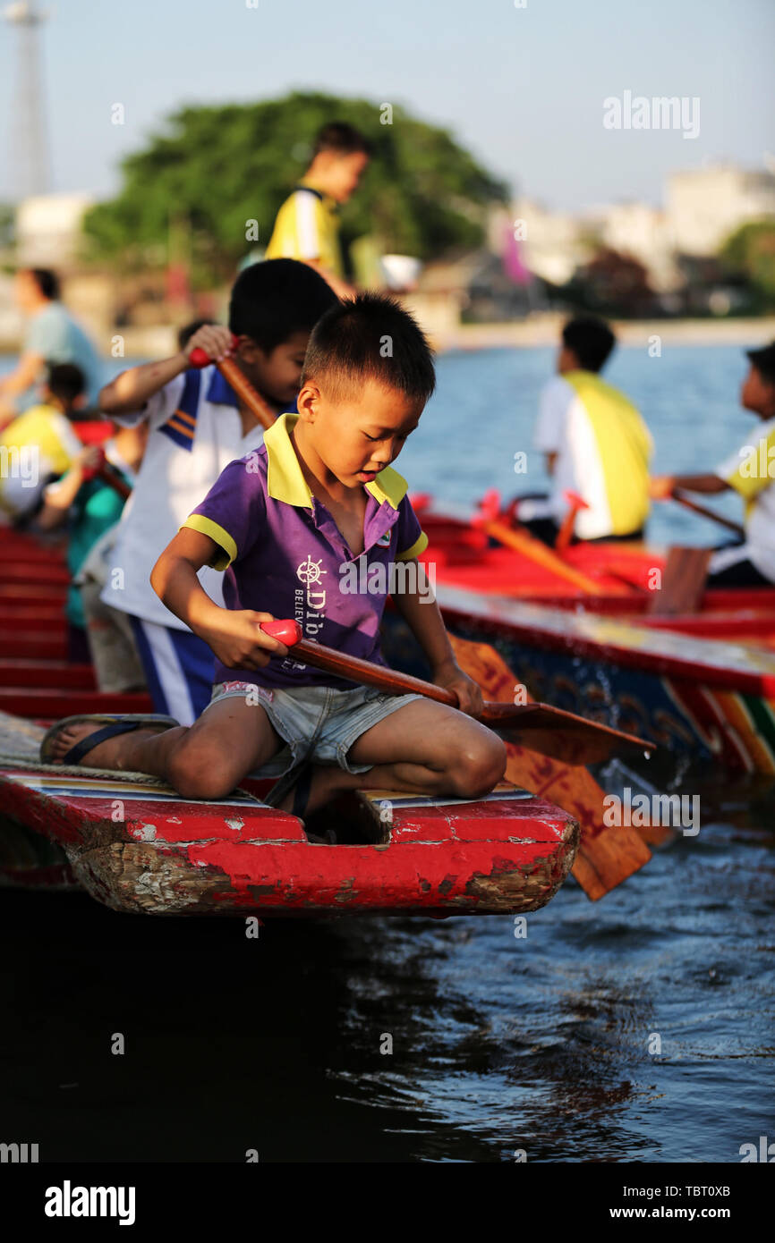 Dragon Boat Festival, dragon boatpaddling child Stock Photo Alamy