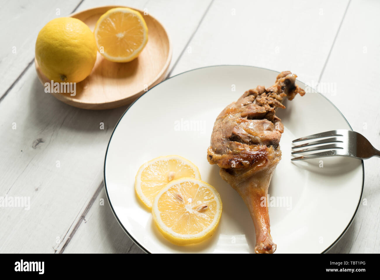 Roast duck leg with light color background Stock Photo - Alamy