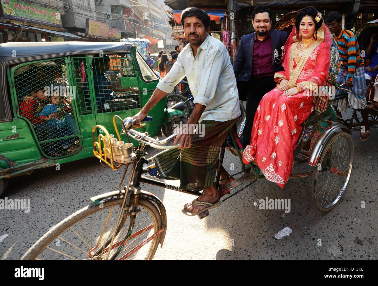 A Bangladeshi newlyweds on a cycle rickshaw in Old Dhaka. Stock Photo