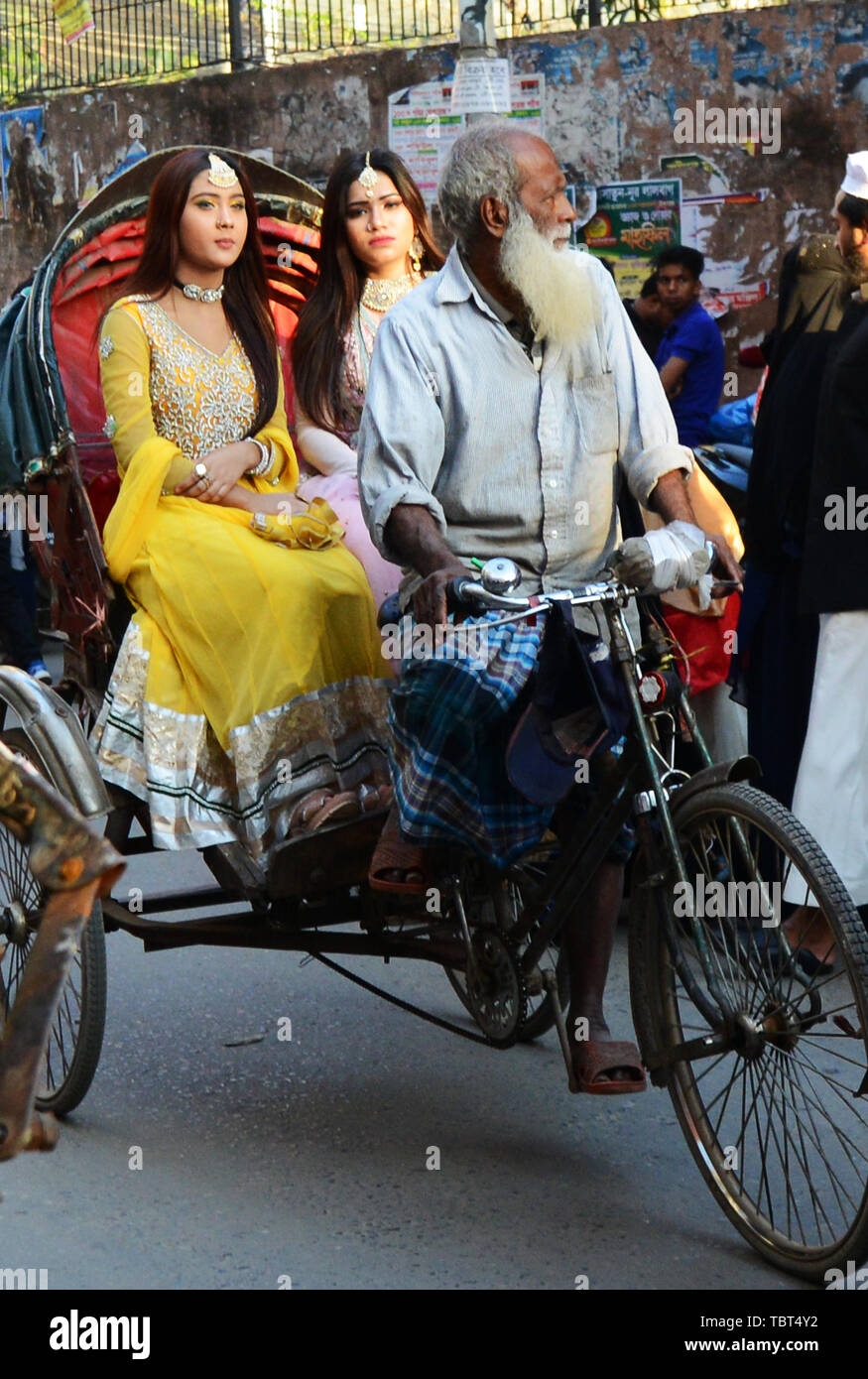 Fashionable Bangladeshi women riding a cycle rickshaw in Dhaka, Bangladesh. Stock Photo