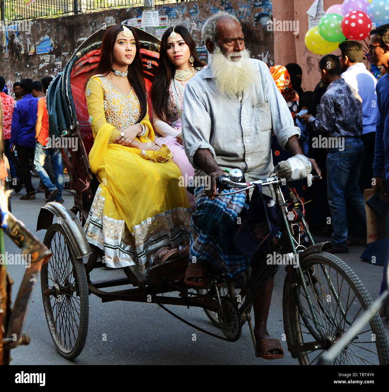 Fashionable Bangladeshi women riding a cycle rickshaw in Dhaka, Bangladesh. Stock Photo