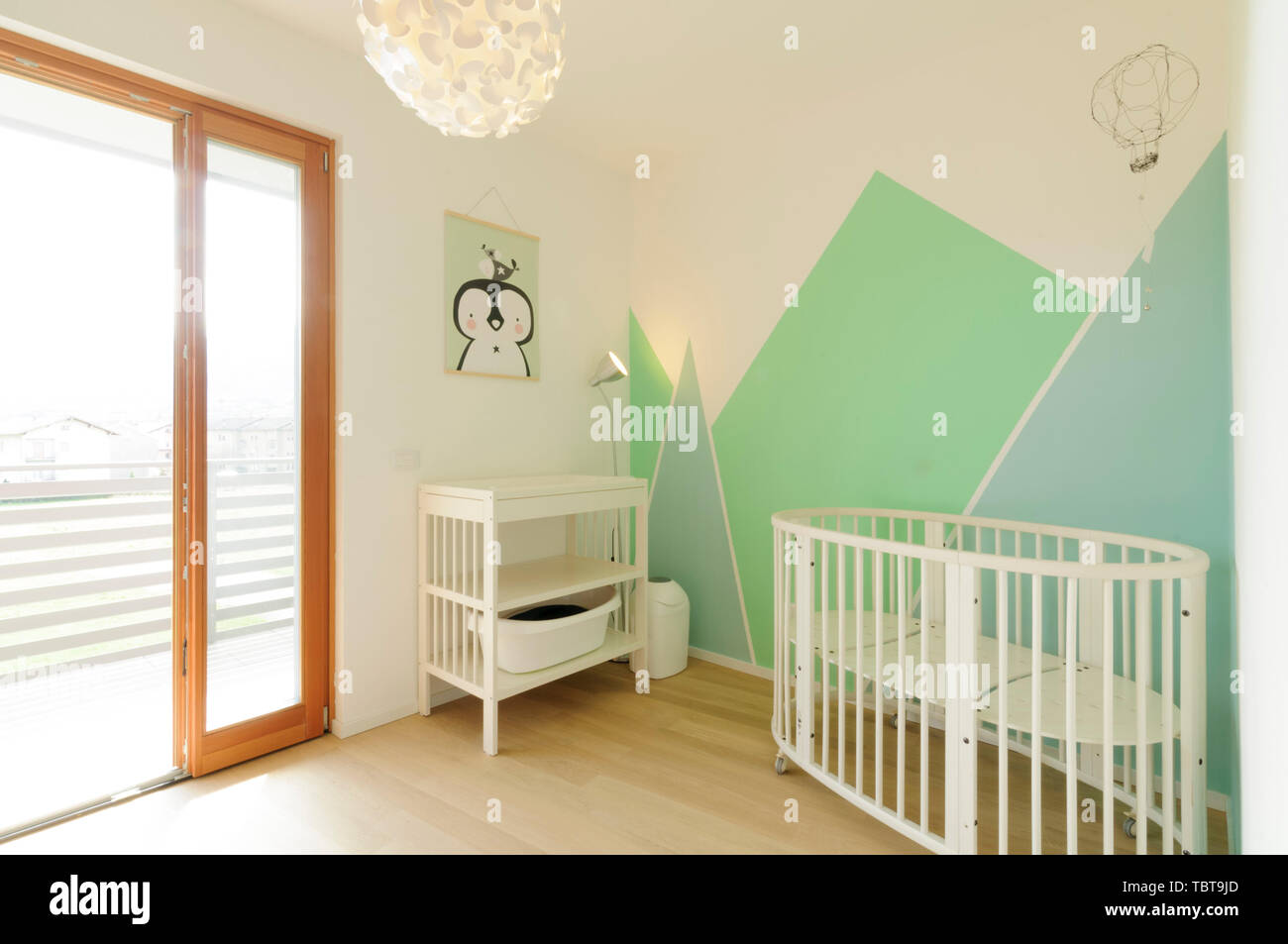 Home Interior Bright Scandinavian Style Nursery With Wooden Floor And Walls Painted With Geometric Shapes In Pastel Colors Stock Photo Alamy