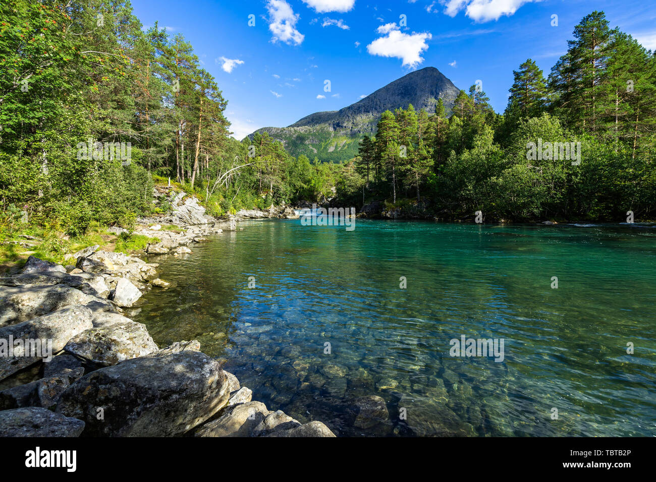 Clear waters of the Valldola River in the beautiful nature of Valldalen Valley, Sunnmore, More og Romsdal, Norway Stock Photo