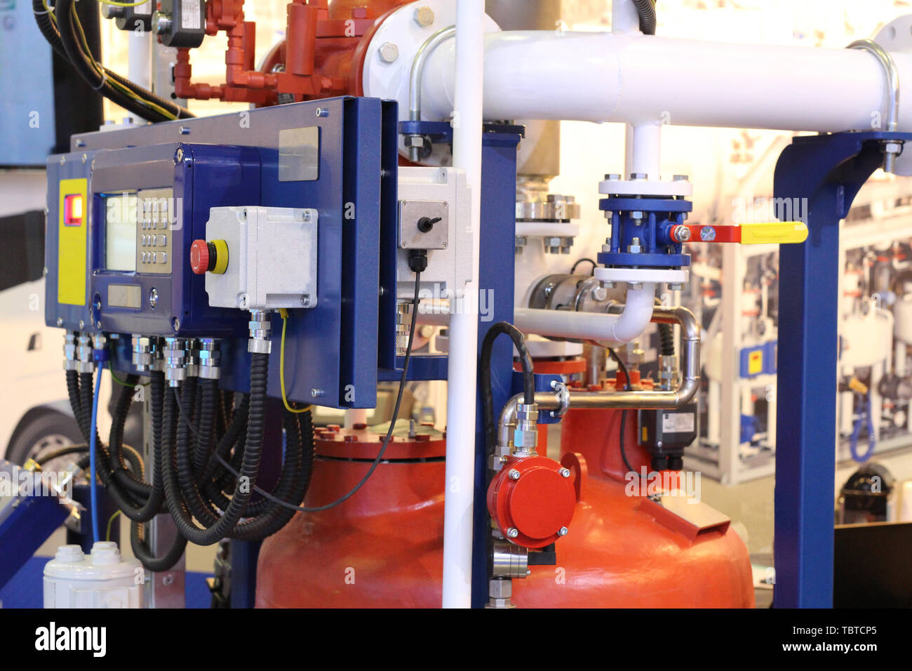 Oil and gas equipment at the plant. Pipes through which gas flows. Oil and gas industry. Production. Stock Photo