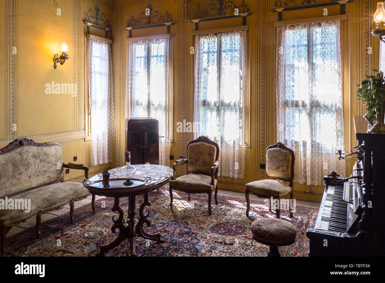 Classic living room with a piano Stock Photo - Alamy