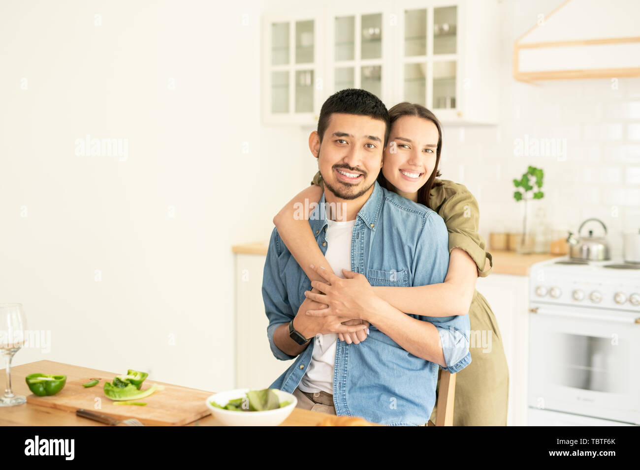 Man woman embrace in kitchen hi-res stock photography and images - Alamy