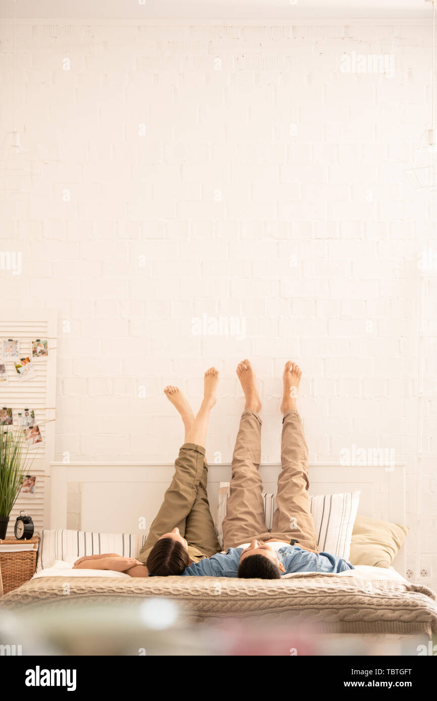 Person relaxing bed home barefoot hi-res stock photography and images ...