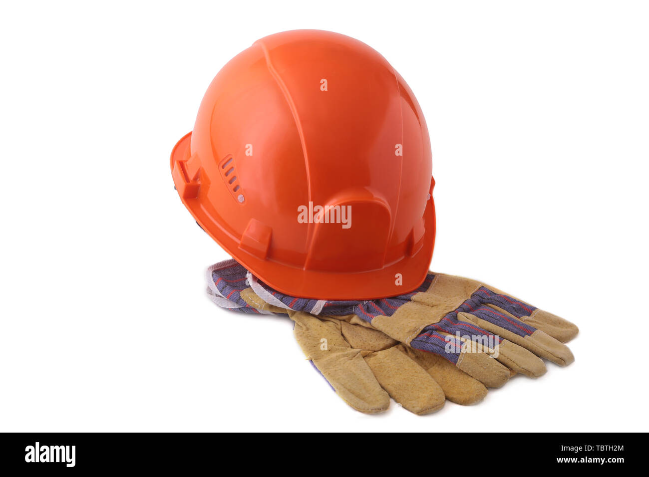 Orange hard hat, safety gloves on white background. Safety helmet Stock  Photo - Alamy