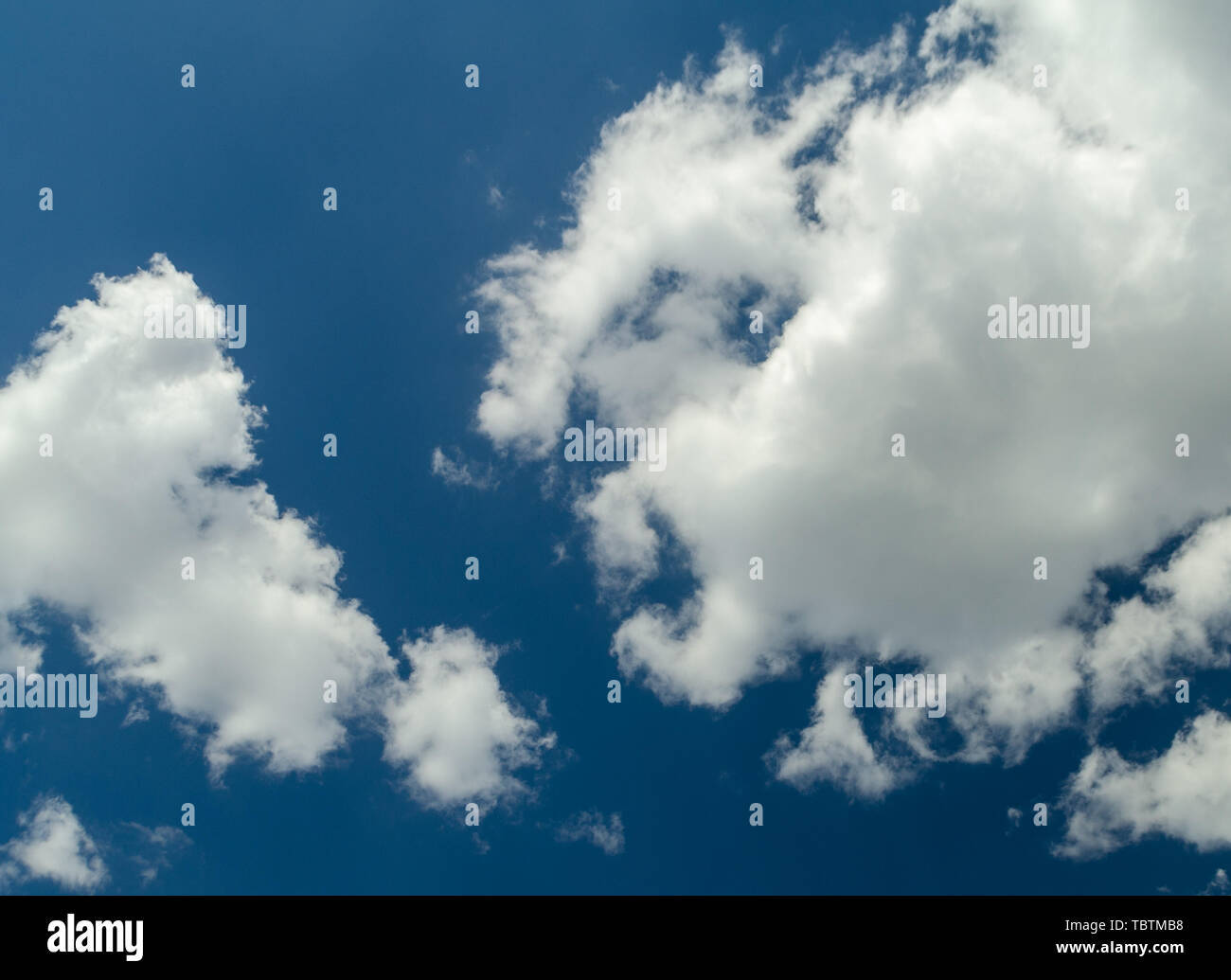 Big white clouds in the blue sky Stock Photo - Alamy