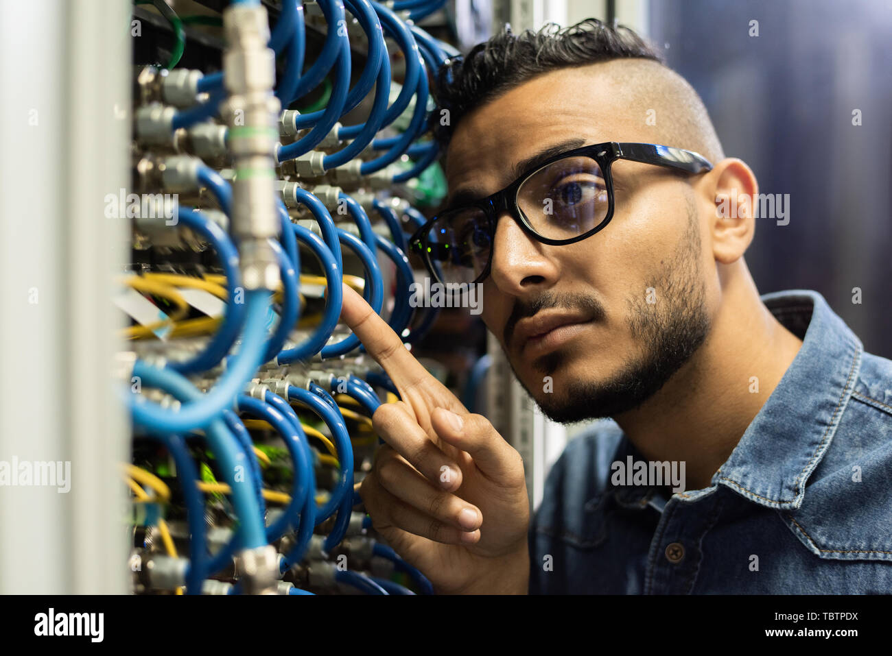 Maintenance engineer examining database server  Stock Photo