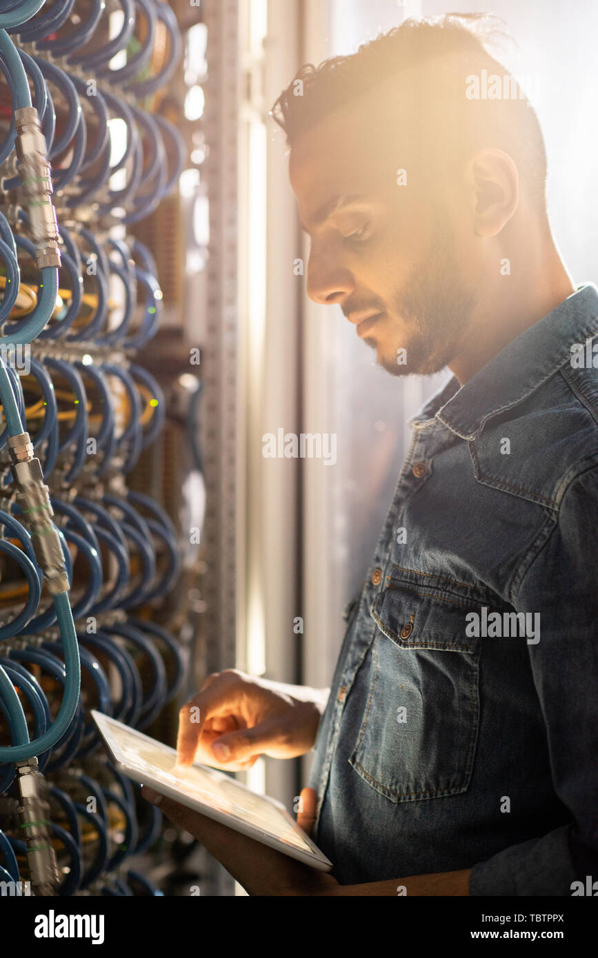 Serious IT engineer viewing test results Stock Photo