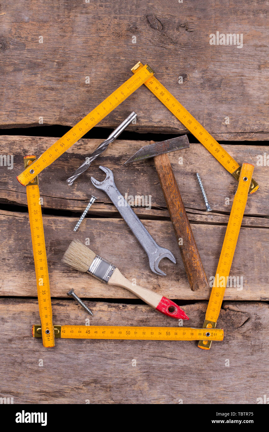 Different hand tools for construction on rustic background. Folding ...