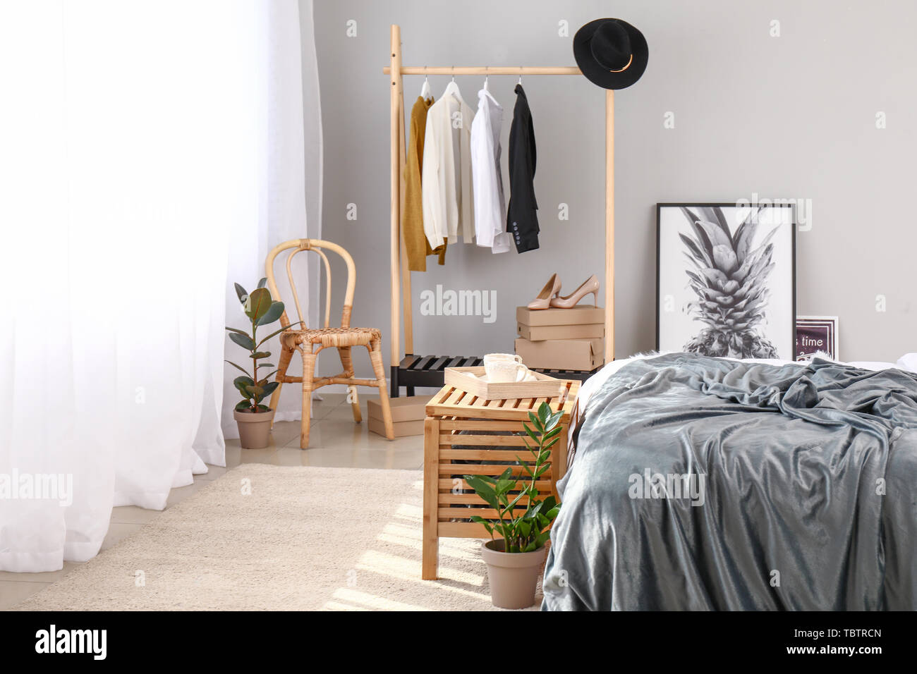 Light Curtains With Stylish Furniture In Interior Of Bedroom Stock