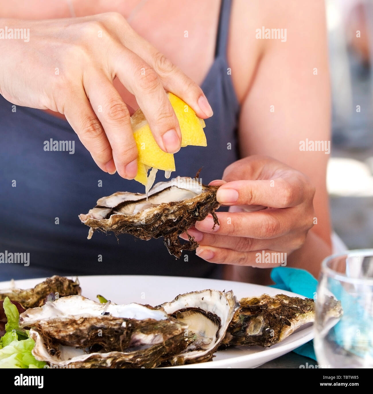 Woman eating oysters hires stock photography and images Alamy