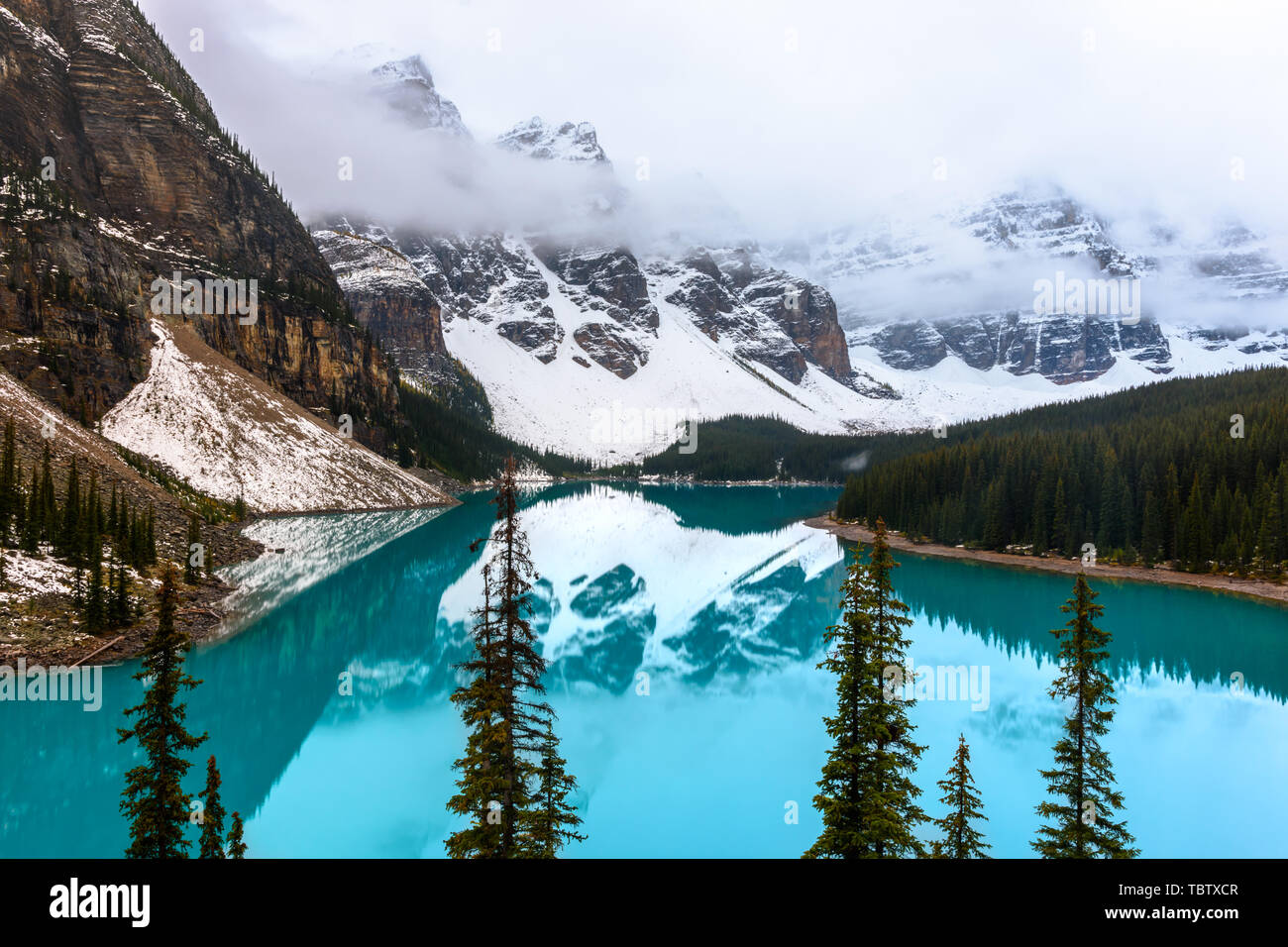 The famous moraine lake at a cloudy day in the Banff national park Stock Photo