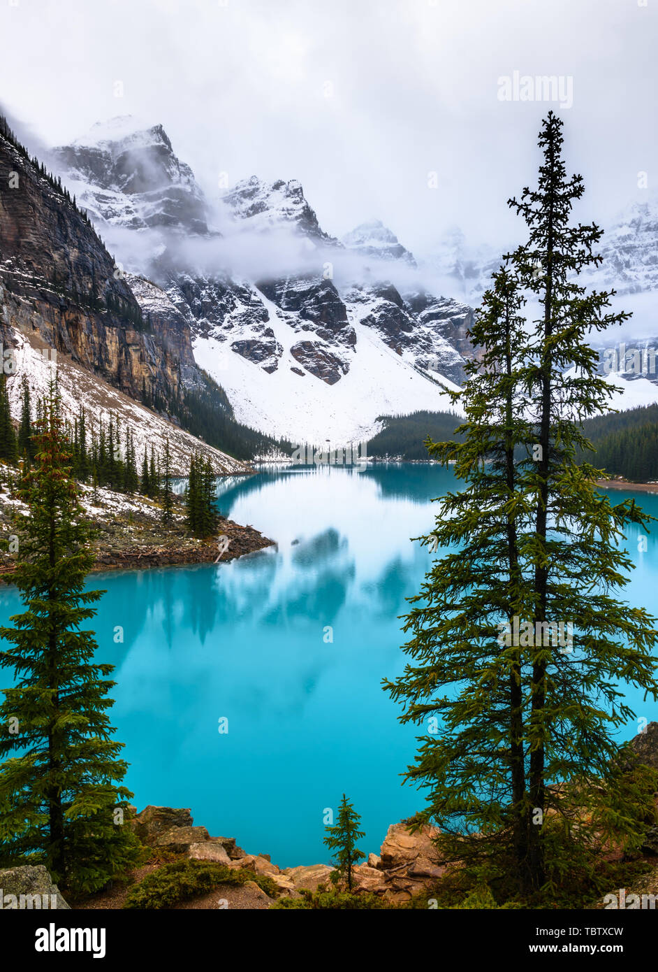 The famous moraine lake at a cloudy day in the Banff national park Stock Photo