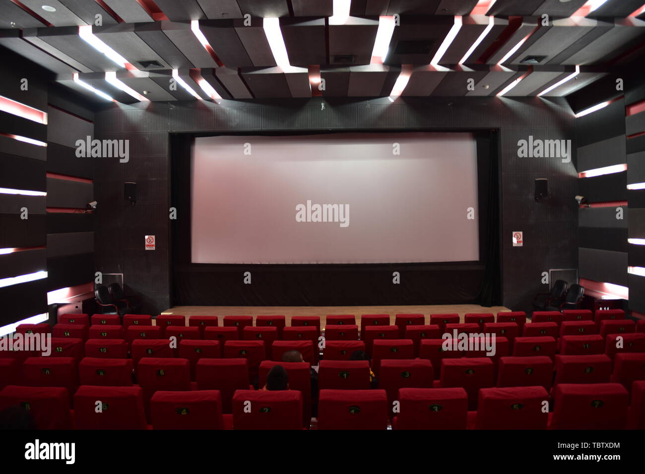 Cinema auditorium seats audience hi-res stock photography and images ...