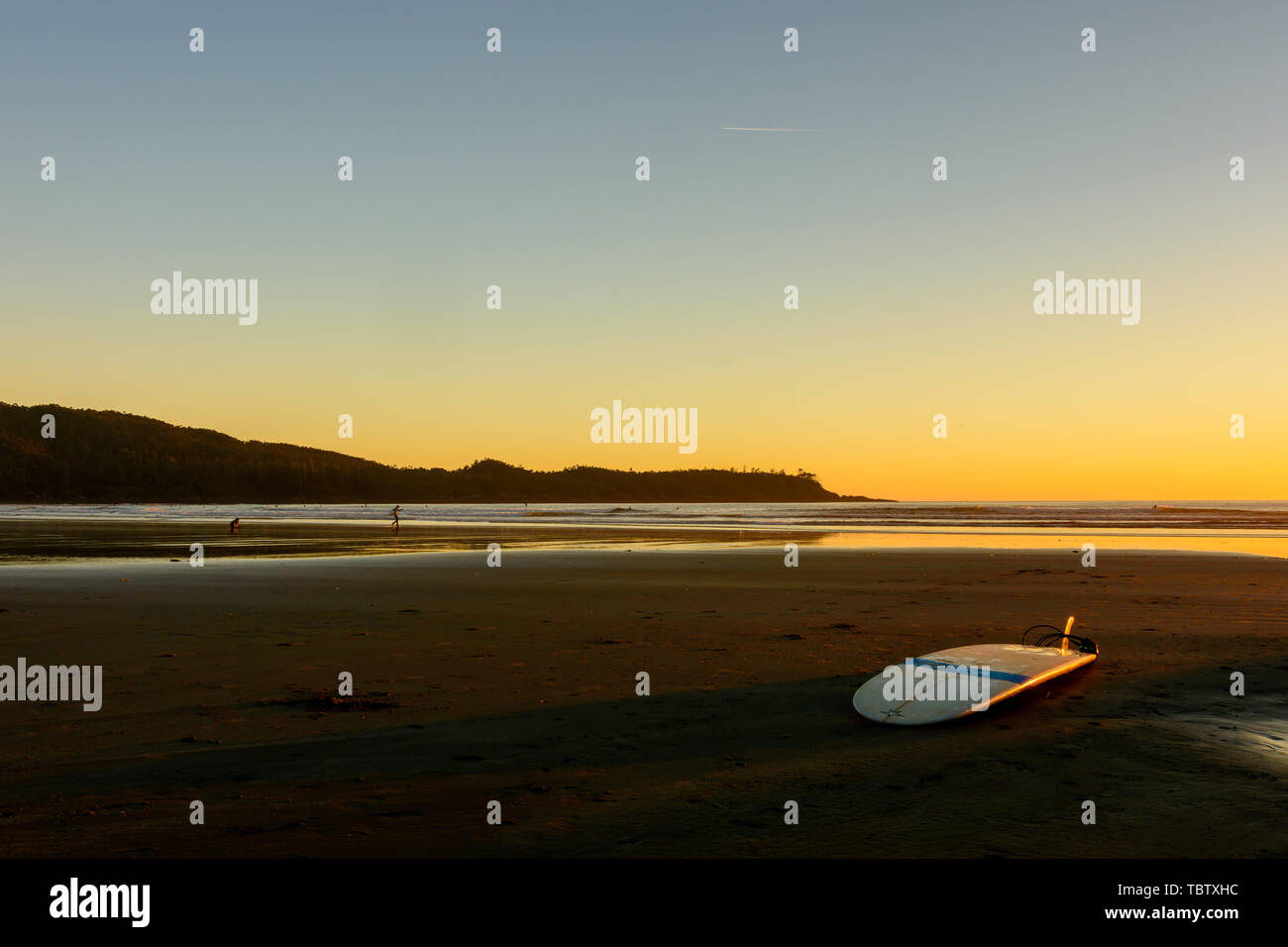 A surfboard is located on a beach on Vancouver Island Stock Photo Alamy