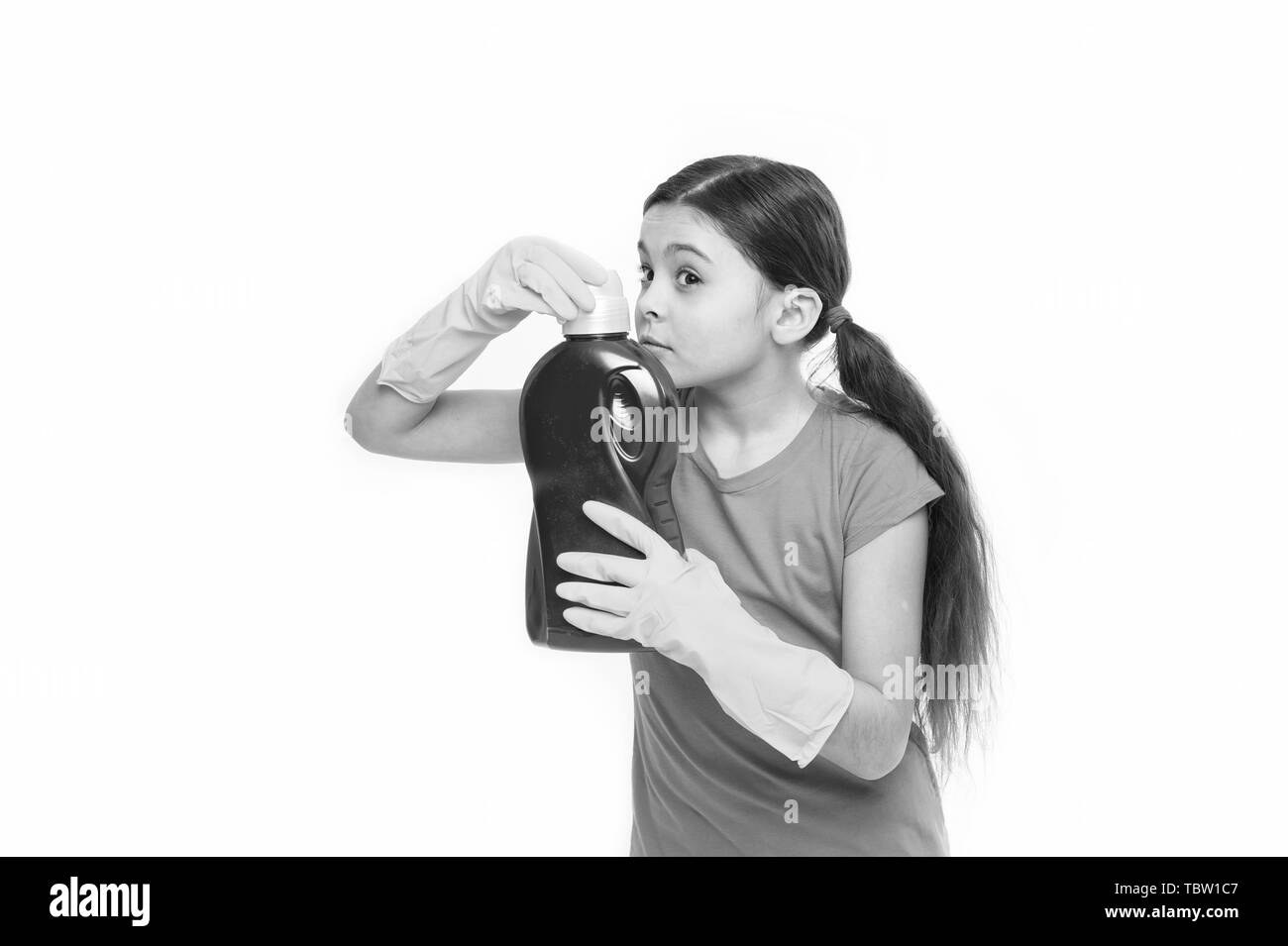 Check smell. Girl in rubber gloves for cleaning hold big plastic bottle