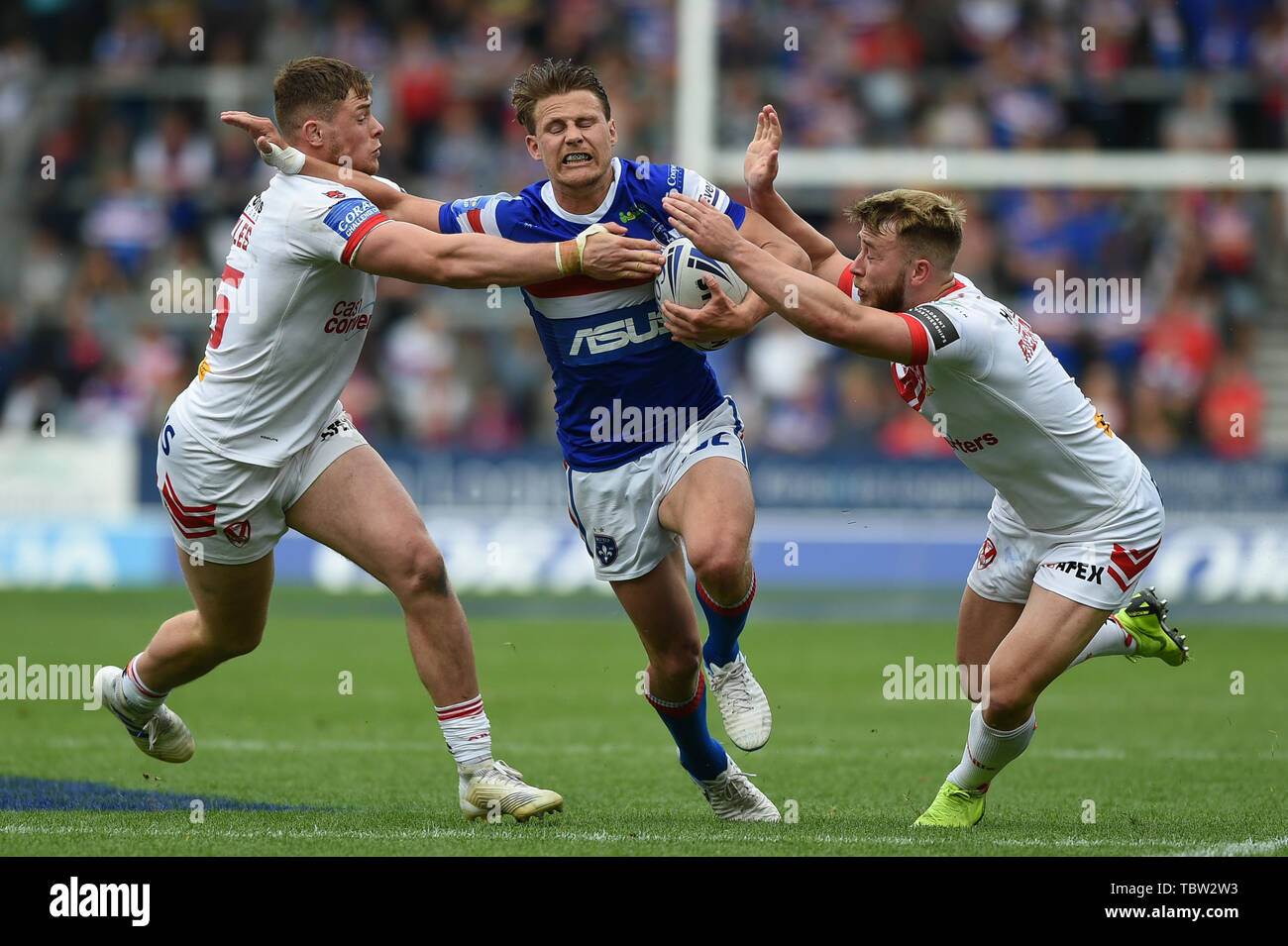 St. Helens, UK, 1 6 2019. 01 June 2019. Totally Wicked Stadium, St. Helens, England; Rugby League Coral Challenge Cup, St. Helens vs Wakefield Trinity;  Wakefield Trinity Captain Jacob Miller finds no way through Saint Helens Morgan Knowles and Danny Richardson.  Dean Williams/RugbyPixUK Stock Photo