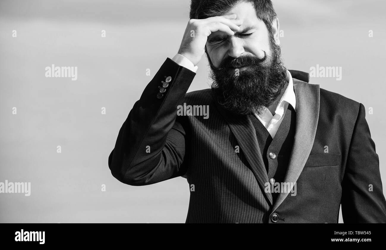 Business failure. Man bearded stressful painful face sky background. Guy suffer headache stressful day. Stressful business. Pain and migraine. Frustration and disappointment. Unforgivable mistake. Stock Photo