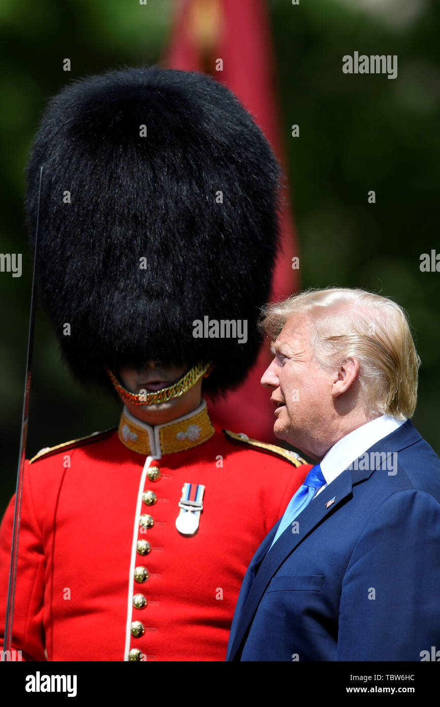 US President Donald Trump inspects the Guard of Honour during a Ceremonial Welcome at Buckingham Palace, London, on day one of his three day state visit to the UK. Stock Photo