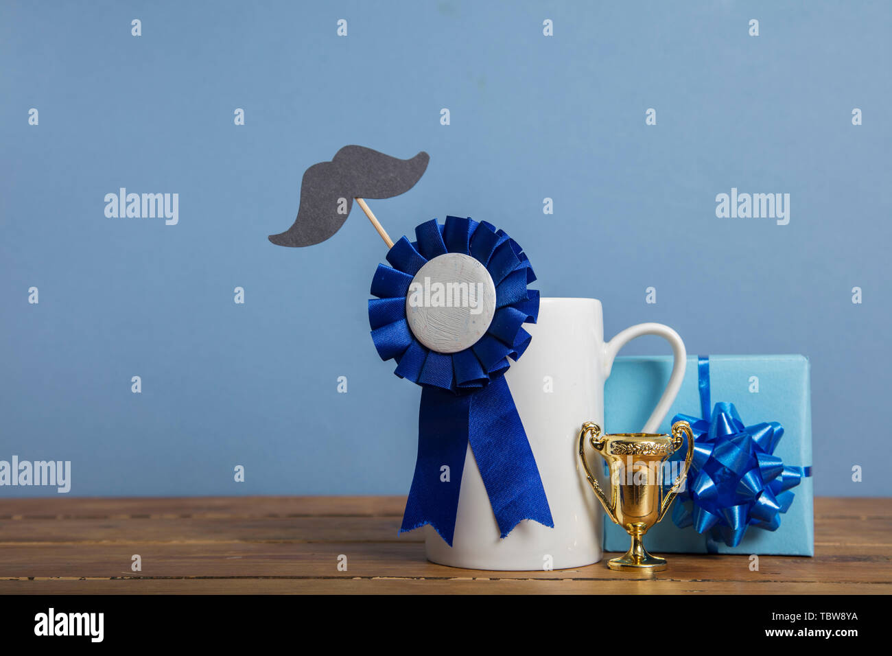 Father's day coffee mug with blue rosette award. Happy father's day concept Stock Photo