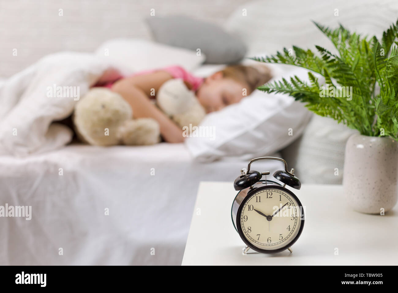 Cute little child girl sleeping with teddy bear in her bed Stock Photo ...