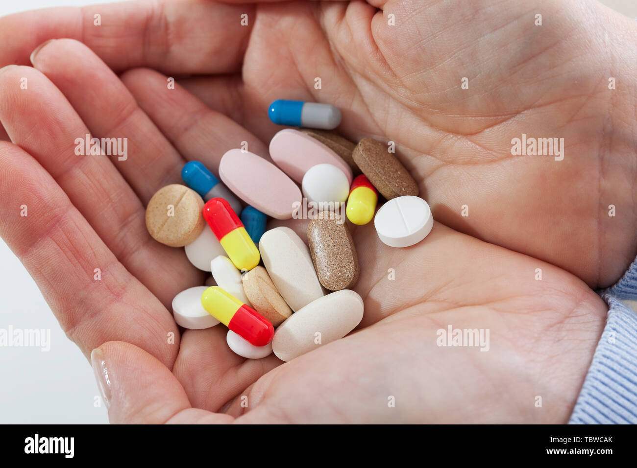Pills on female hands , Suicide concept Stock Photo