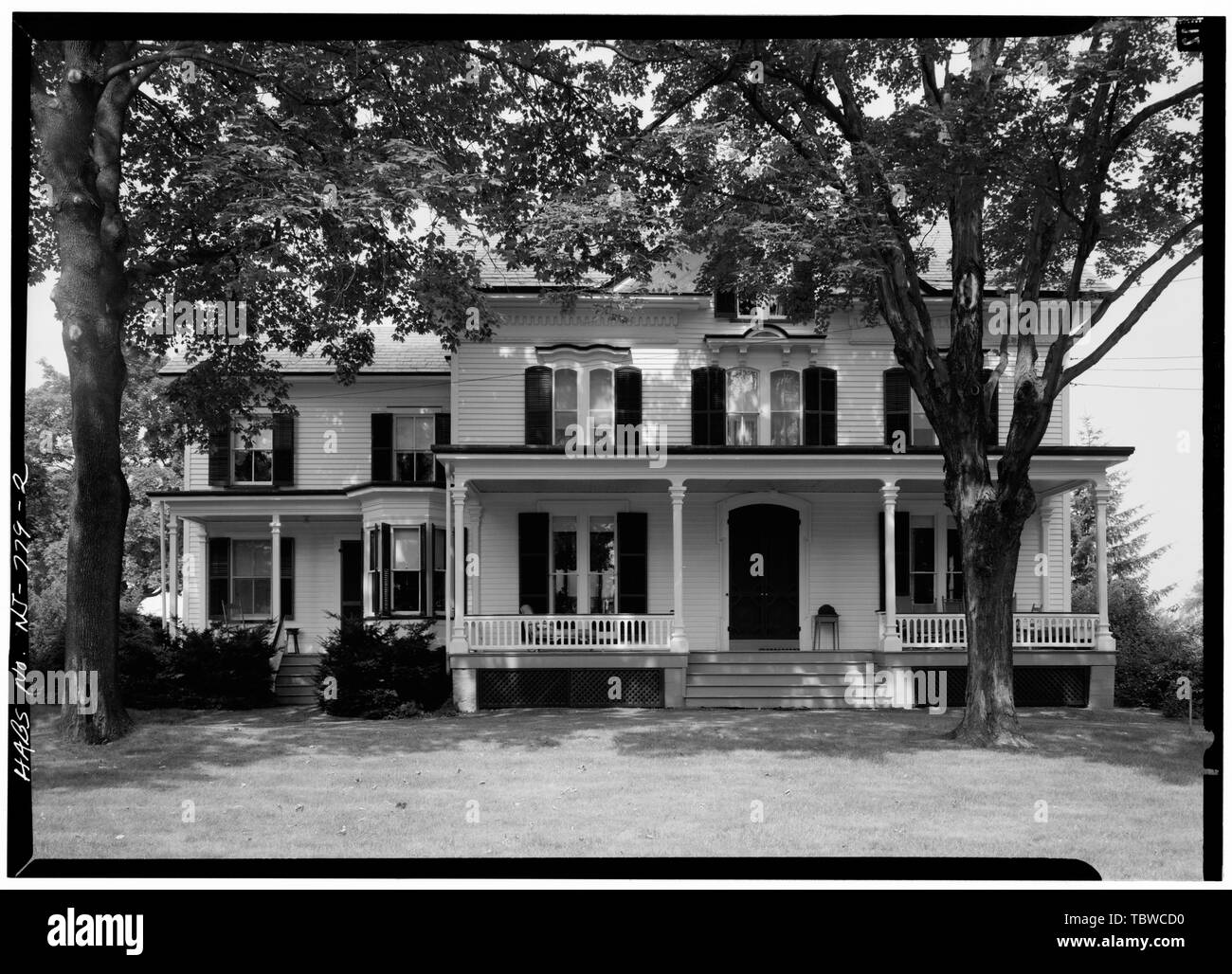 MAIN ELEVATION, SHOWING FULLLENGTH PORCH, BAY WINDOW AND CORBELED