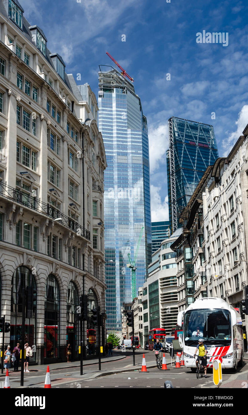 A London street with old buildings in the foreground with modern