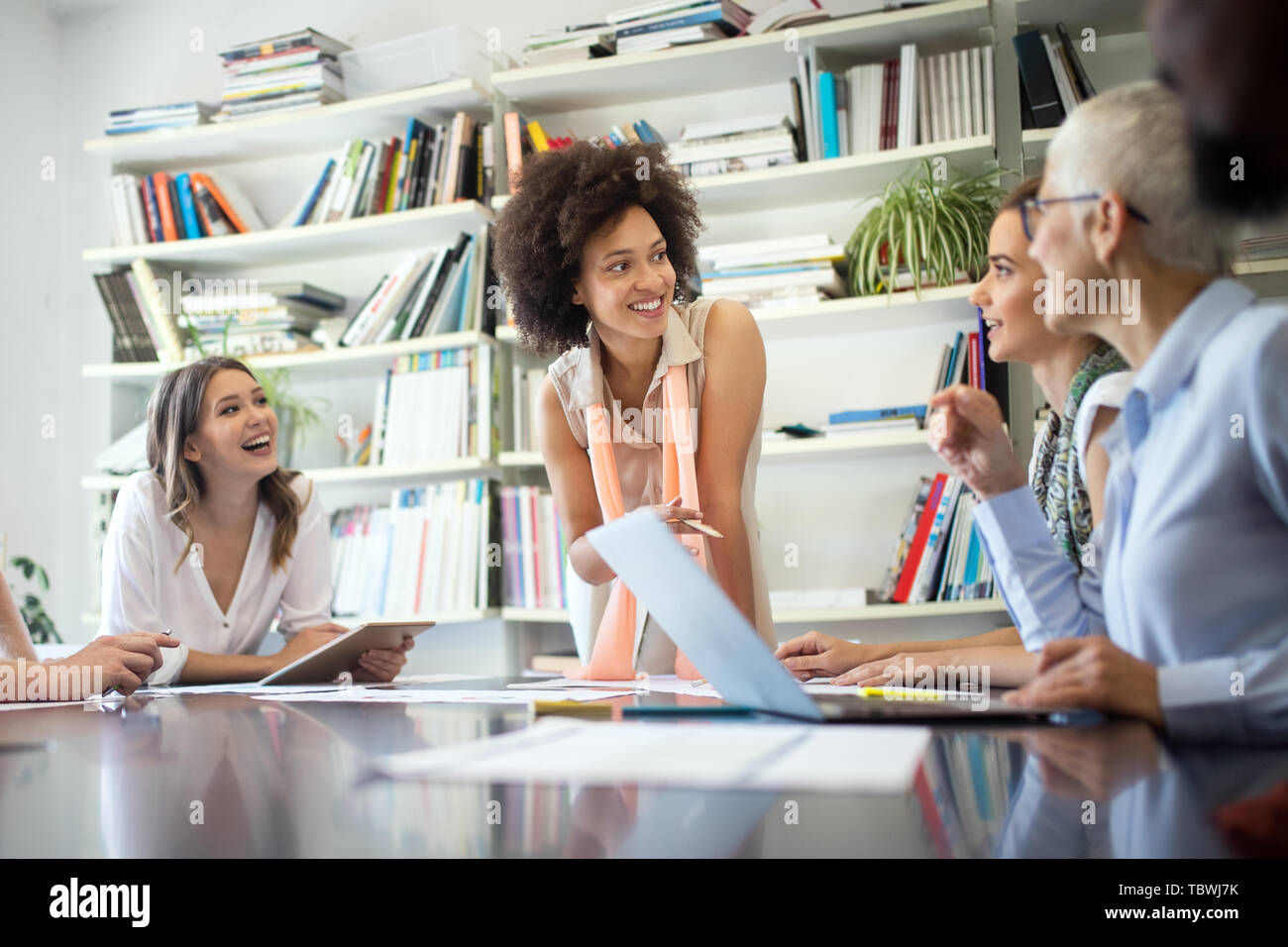Programmers cooperating at IT company developing apps Stock Photo