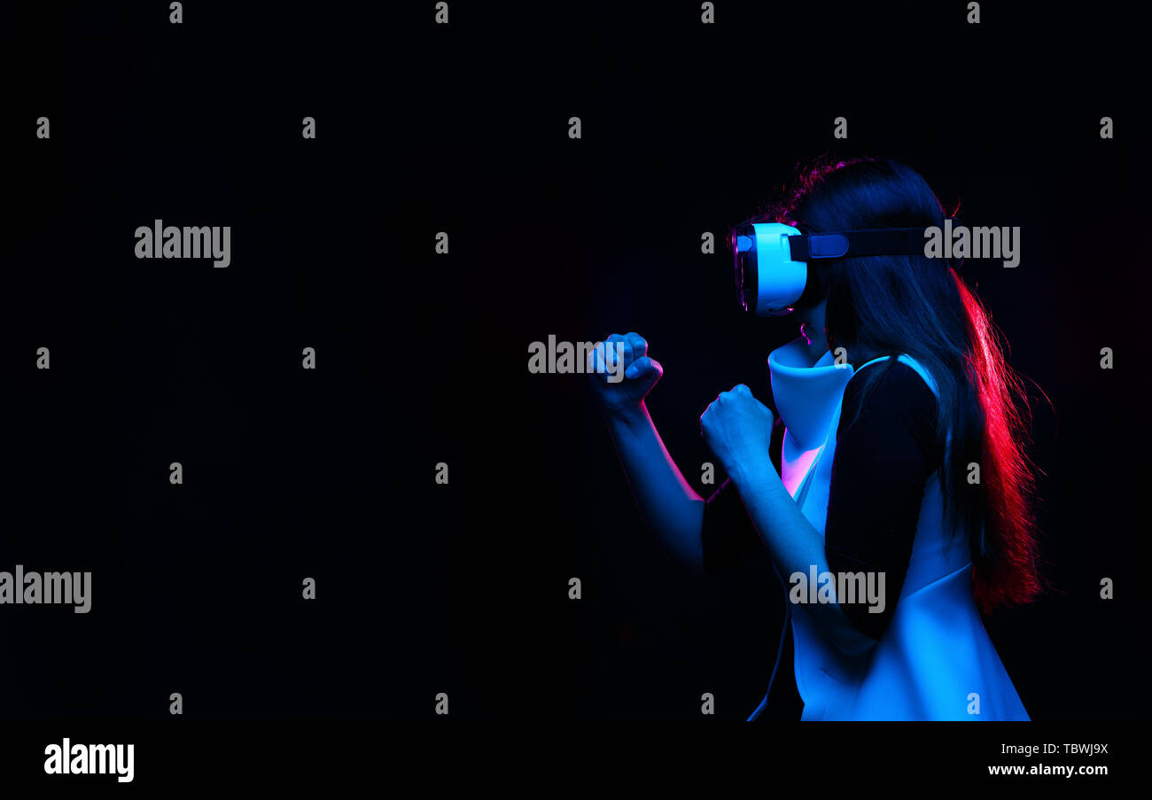Woman is using virtual reality headset. Image with glitch effect. Stock Photo