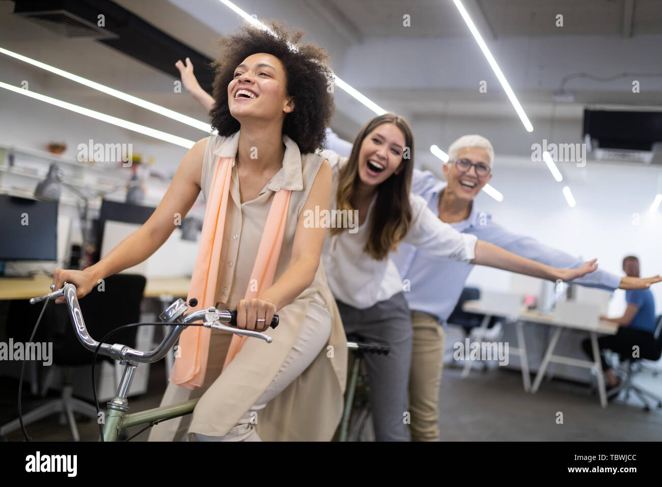 Carefree diverse office workers having fun during work break Stock Photo