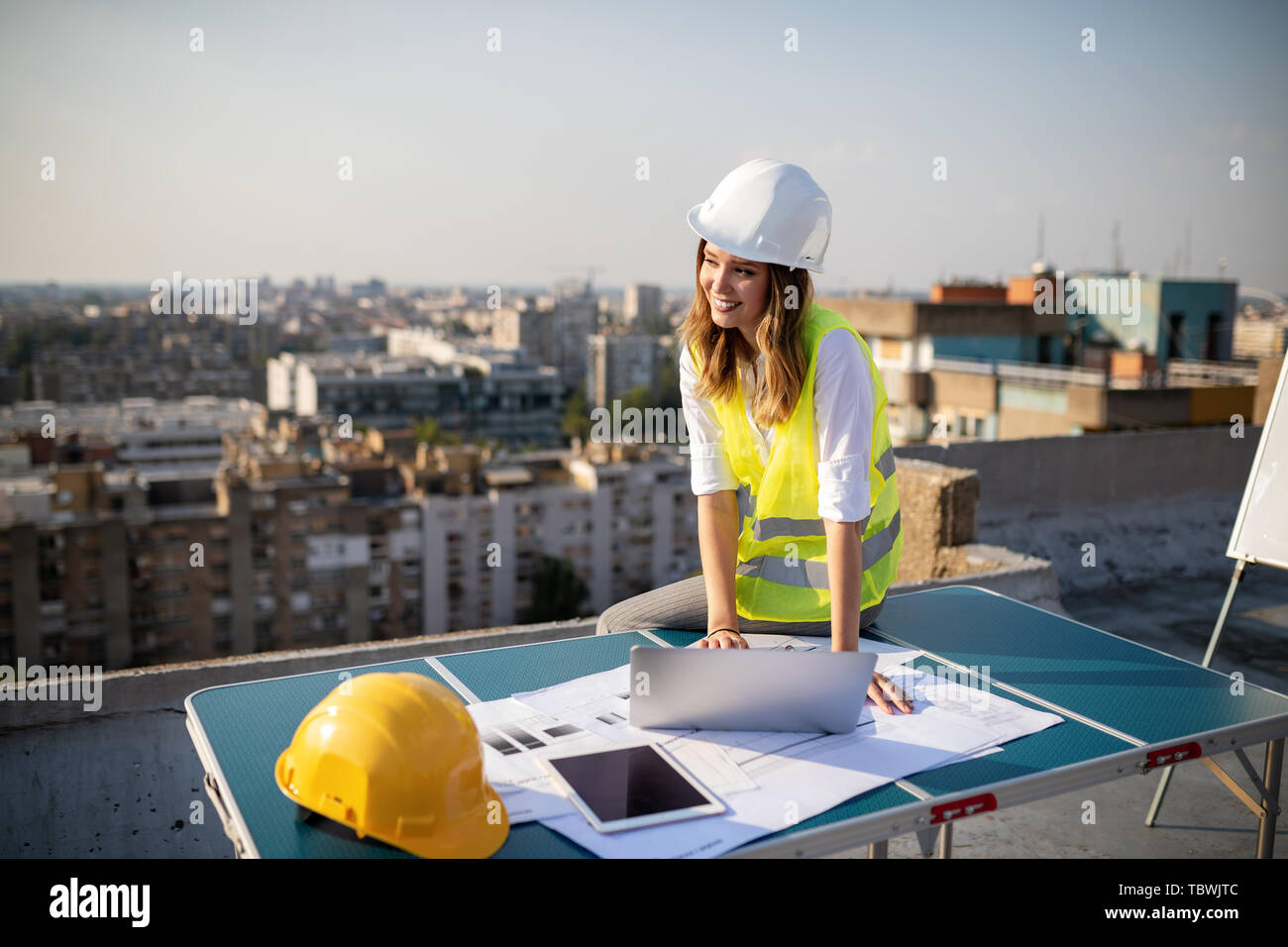 Young woman architect, construction engineer at a construction site Stock Photo
