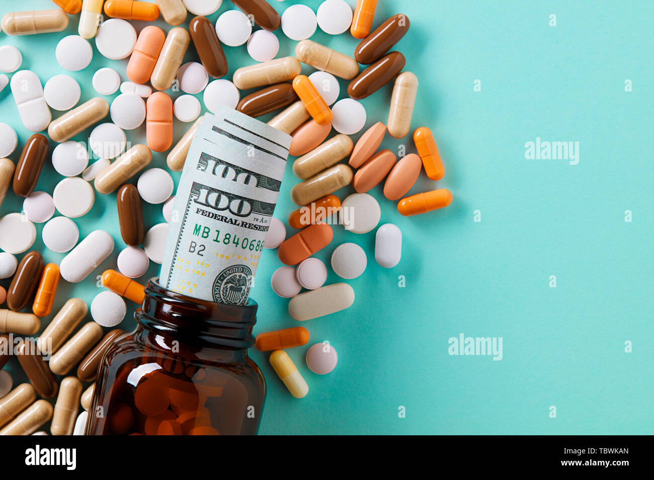 USD dollar bills in a drug bottle over the medical pills. Medicine