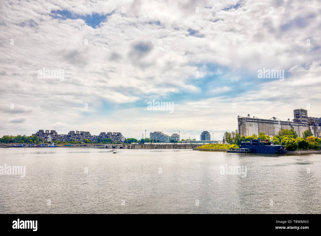 Montreal, Canada - June, 2018: Old port, saint lawrence river, Bota bota spa and historical grain factory silo No.5 in Montreal, Quebec, Canada. Edito Stock Photo