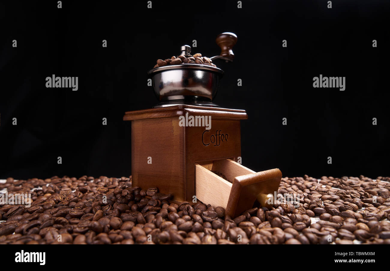 Handmade bean grinders and coffee beans Stock Photo Alamy