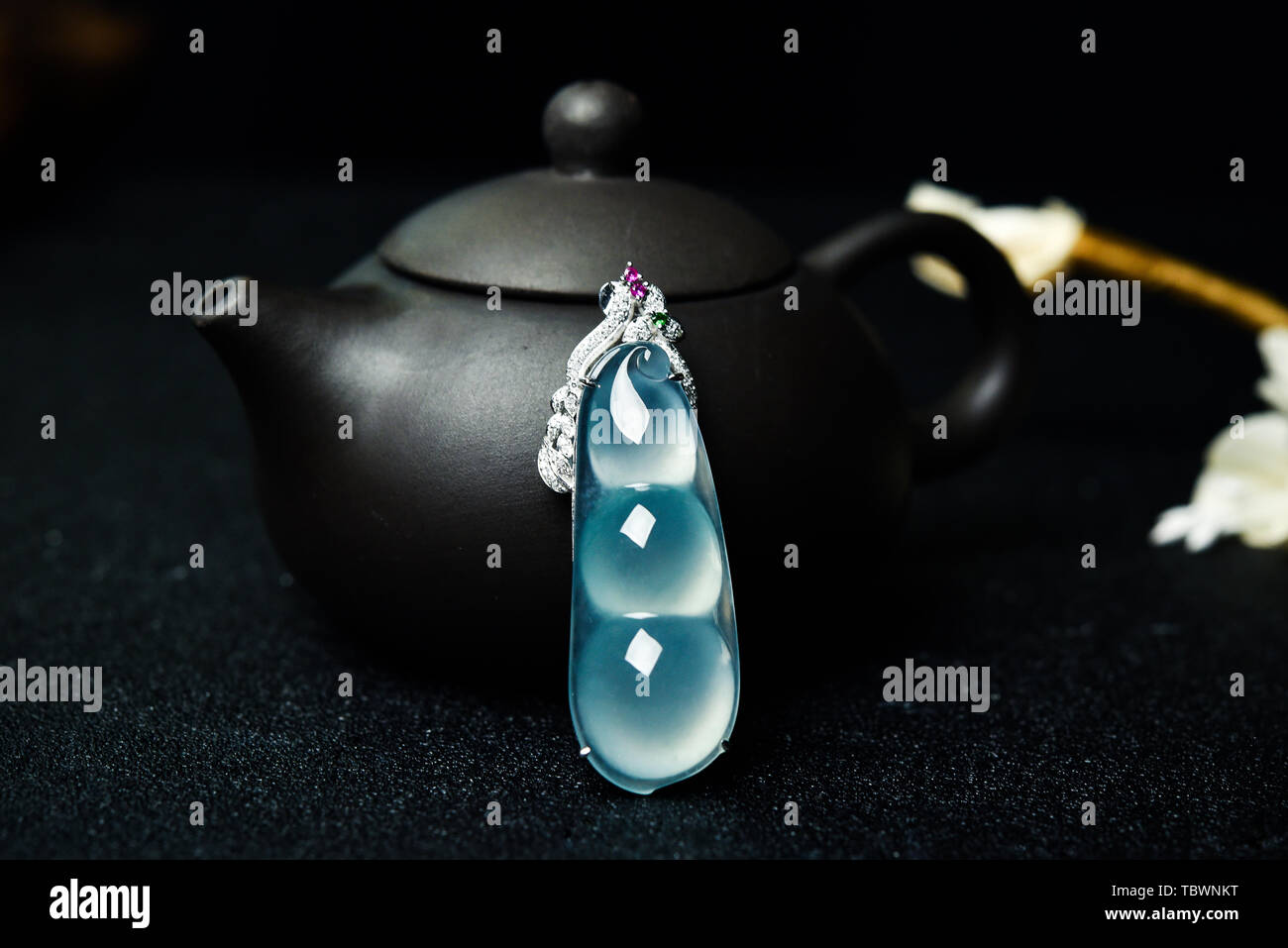 Jade bean pendant, jade jewellery Stock Photo Alamy